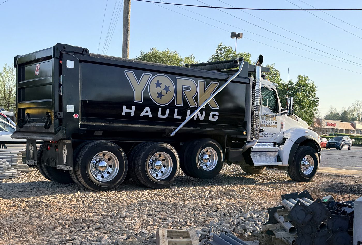 York Hauling dump truck dumping gravel